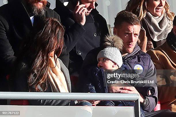 Jamie Vardy of Leicester City looks on from the stand next to his wife Rebekah holding his son Finlay during The Emirates FA Cup Third Round match...