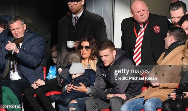 Jamie Vardy of Leicester City and his wife Rebekah look on from the stands during the The Emirates FA Cup Third Round match between Fleetwood Town...