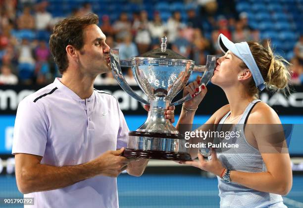 Roger Federer and Belinda Bencic of Switzerland pose with the Hopman Cup trophy after defeating Alexander Zverev and Angelique Kerber of Germany in...