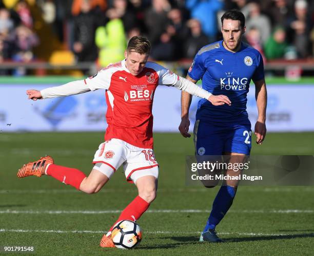 George Glendon of Fleetwood Town is chased by Matty James of Leicester City during the The Emirates FA Cup Third Round match between Fleetwood Town...