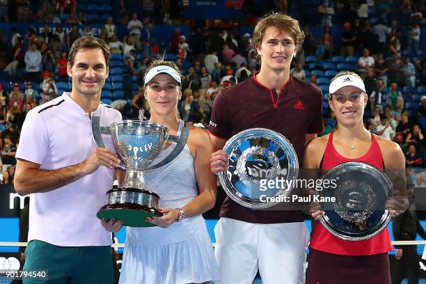 Roger Federer and Belinda Bencic of Switzerland pose with the Hopman Cup trophy together with Alexander Zverev and Angelique Kerber of Germany with...