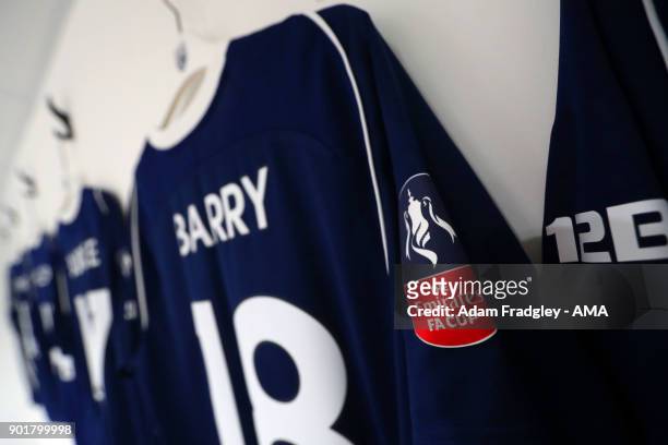 The Emirates FA Cup badge on one of the West Bromwich Albion players match shirts prior to the The Emirates FA Cup Third Round match between Exeter...