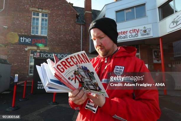 Programme seller prior to the The Emirates FA Cup Third Round match between Exeter City v West Bromwich Albion at St James Park on January 6, 2018 in...