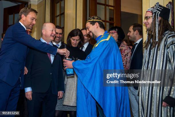 Christian Lindner , head of the German Free Democratic Party is seen with carollers dressed as the Three Kings during the traditional Epiphany...