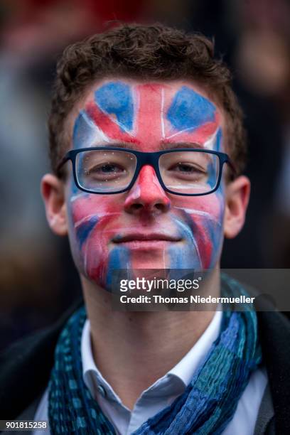 Member of the Junge Liberale is seen with a painted Union Jack in his face during the traditional Epiphany meeting of the German Free Democratic...