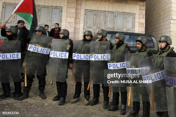 Palestinian policemen stand guard as the convoy of Jerusalem's Greek Orthodox patriarch Theophilos III arrives in the West Bank town of Bethlehem on...