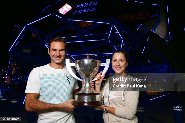 Roger Federer and Belinda Bencic of Switzerland pose with the Hopman Cup trophy after defeating Alexander Zverev and Angelique Kerber of Germany in...