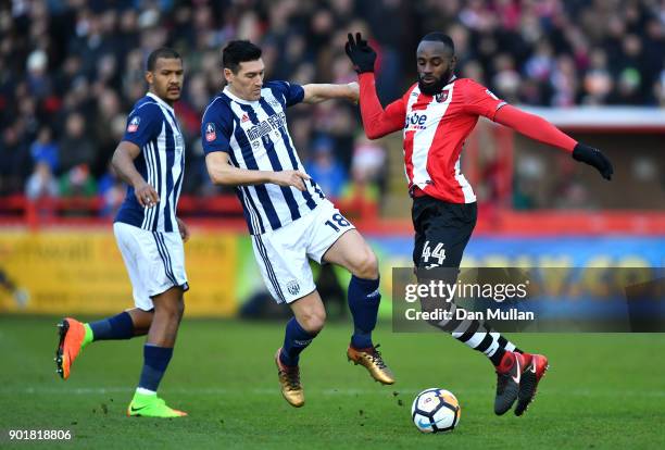 Gareth Barry of West Bromwich Albion challenges Hiram Boateng of Exeter City during the The Emirates FA Cup Third Round match between Exeter City and...