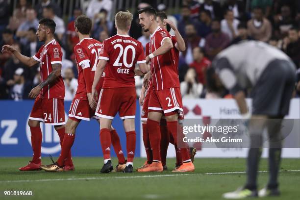 Sandro Wagner of Muenchen celebrates his team's first goal with team mates during the friendly match between Al-Ahli and Bayern Muenchen on day 5 of...