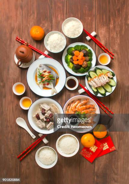 flat lay chinese new year reunion dinner, food and drink still life. - lunar new year cup 2017 stock-fotos und bilder