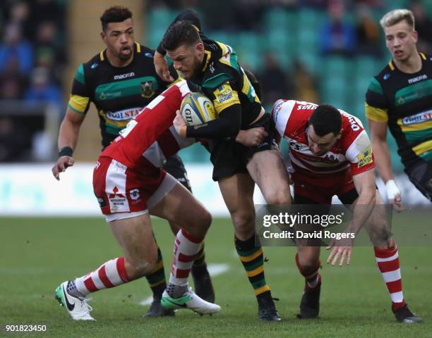 Rob Horne of Northampton is tackled during the Aviva Premiership match between Northampton Saints and Gloucester Rugby at Franklin's Gardens on...