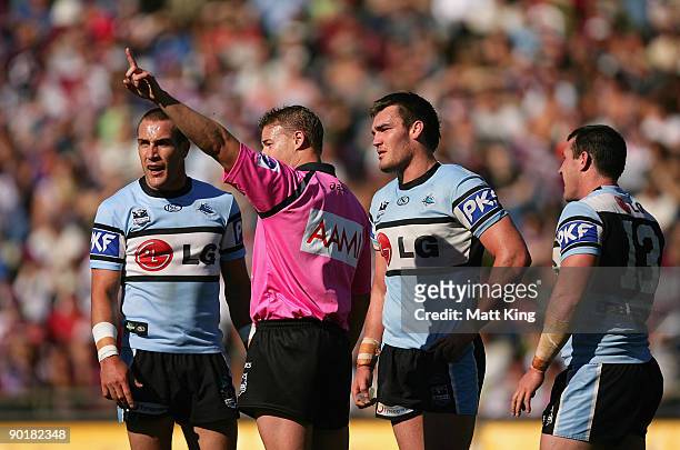 Luke Douglas of the Sharks is sent off by referee Phil Haines for a high tackle on Chris Bailey of the Sea Eagles as Sharks captain Luke Covell...