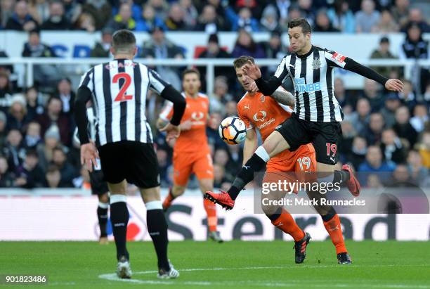 Javi Manquillo of Newcastle United James Collins of Luton Town during the The Emirates FA Cup Third Round match between Newcastle United and Luton...