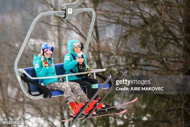 Mikaela Shiffrin of the United States and her mother Eileen Shiffrin ride on a chairlift prior to the second run of the FIS World Cup Ladies Giant...