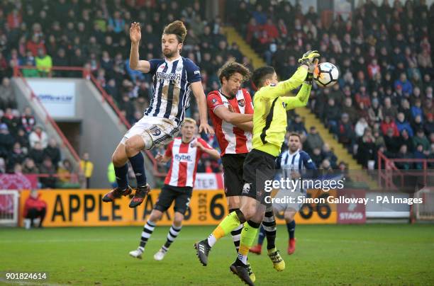 West Bromwich Albion's Jay Rodriguez and Exeter City's Daniel Seaborne battle for the ball in the air during the FA Cup, third round match at St...