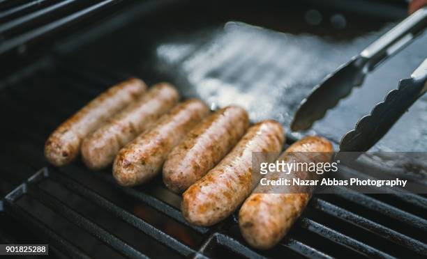 sausage barbecue. - sausage stock-fotos und bilder