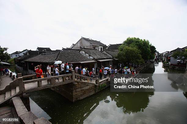 Tourists go sightseeing on August 29, 2009 in Zhouzhuang Town of Kunshan City, Jiangsu Province, China. Zhouzhuang, first built around 1,000 years...