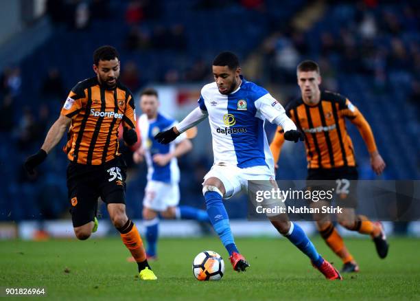 Dominic Samuel of Blackburn Rovers and Kevin Stewart of Hull City in action during The Emirates FA Cup Third Round match between Blackburn Rovers and...