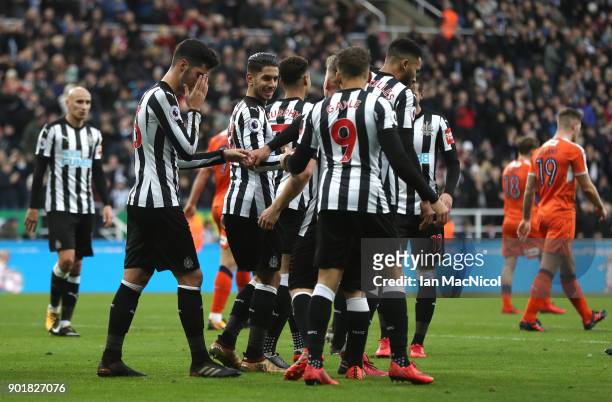 Ayoze Perez of Newcastle United celebrates scoring the opening goal with team mates during The Emirates FA Cup Third Round match between Newcastle...