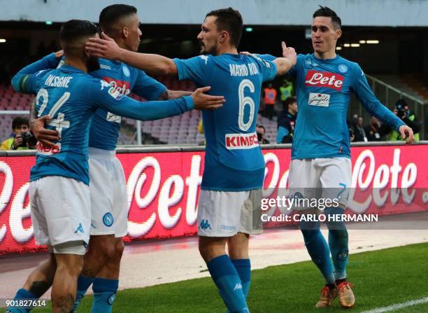 Napoli's Spanish striker Jose Maria Callejon celebrates with teammates after scoring during the Italian Serie A football match SSC Napoli vs Hellas...