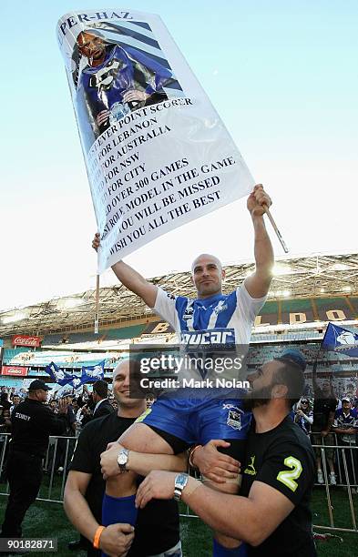 Nolan Stringer Hazem El Masri is chaired off after the round 25 NRL match between ...