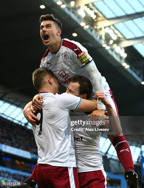 Matthew Lowton of Burnley celebrates with Ashley Barnes after he scored his sides first goal during the The Emirates FA Cup Third Round match between...