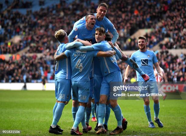 Jordan Willis of Coventry City celebrates with teammates after scoring his sides first goal during The Emirates FA Cup Third Round match between...