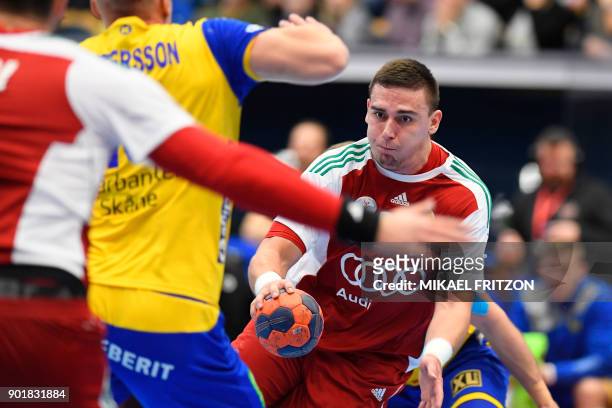 Hungary's Richard Bodo plays the ball during a friendly handball match between Sweden and Hungary at Kinnarp Arena, Jonkoping, Sweden, on January 6,...