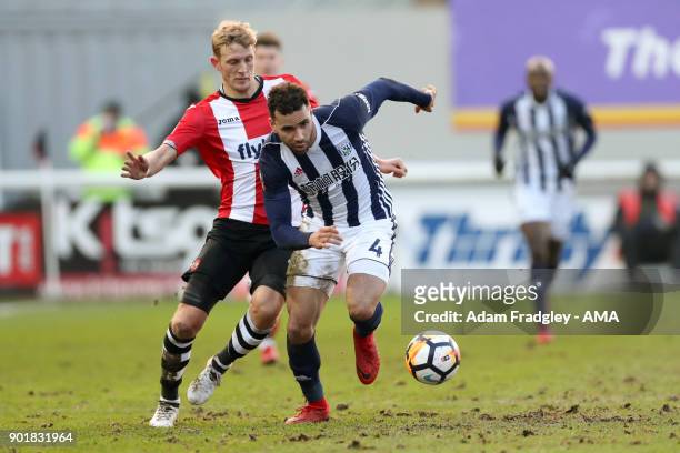 Hal Robson-Kanu of West Bromwich Albion and Dean Moxey of Exeter City during to the The Emirates FA Cup Third Round match between Exeter City v West...