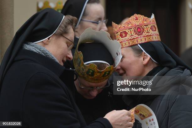 Participants wear crowns during the annual 'Orszak Trzech Kroli' in Krakow city center. The procession, which annually marks the end of the Christmas...