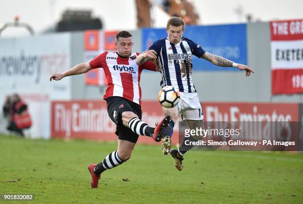 Exeter City's Pierce Sweeney and West Bromwich Albion's James McClean battle for the ball during the FA Cup, third round match at St James' Park,...