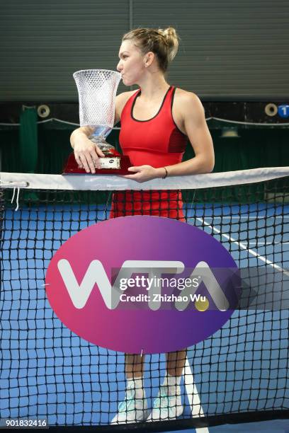 Simona Halep of Romania celebrates with trophy after winning the final match against Katerina Siniakova of Czech Republic during Day 7 of 2018 WTA...