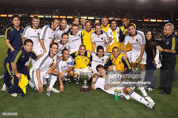 The Los Angeles Galaxy pose with the Honda Super Clasico trophy after defeating Chivas USA on August 29, 2009 at the Home Depot Center in Carson,...