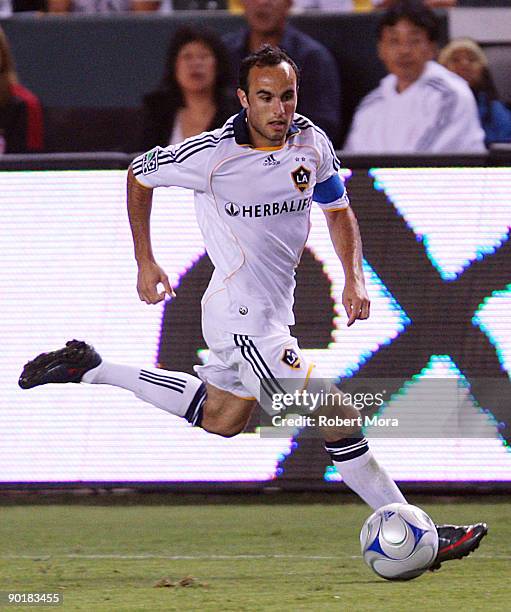 Landon Donovan of the Los Angeles Galaxy attacks the defense of Chivas USA during their MLS game at The Home Depot Center on August 29, 2009 in...