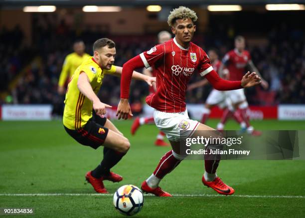 Lloyd Kelly of Bristol City is challenged by Tom Cleverley of Watford during The Emirates FA Cup Third Round match between Watford and Bristol City...