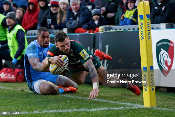 Adam Thompstone of Leicester Tigers and Joe Cokanasiga of London Irish during the Aviva Premiership match between Leicester Tigers and London Irish...