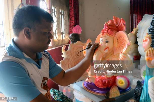 An artist busy in making lord Ganesha Idols for upcoming Maghi Ganesh Utsav which is on 21st January in Kalyan, on January 5, 2018 in Mumbai, India....