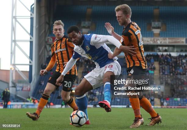 Blackburn Rovers' Joe Nuttall under pressure from Hull City's Max Clark and Hull City's Jarrod Bowen during the Emirates FA Cup Third Round match...