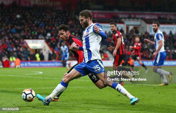 Nick Powell of Wigan Athletic and Adam Smith of AFC Bournemouth in action during the The Emirates FA Cup Third Round match between AFC Bournemouth...