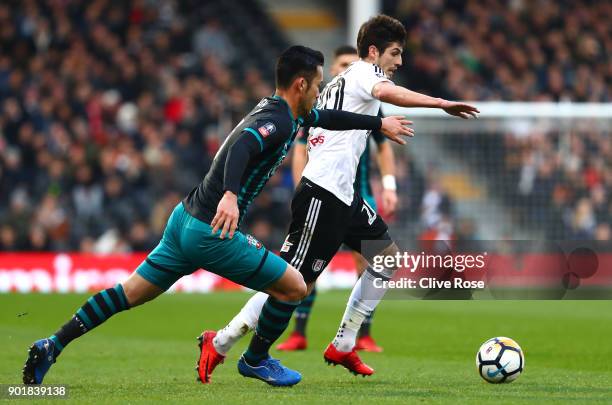 Lucas Piazon of Fulham is challenged by Maya Yoshida of Southampton during The Emirates FA Cup Third Round match between Fulham and Southampton at...