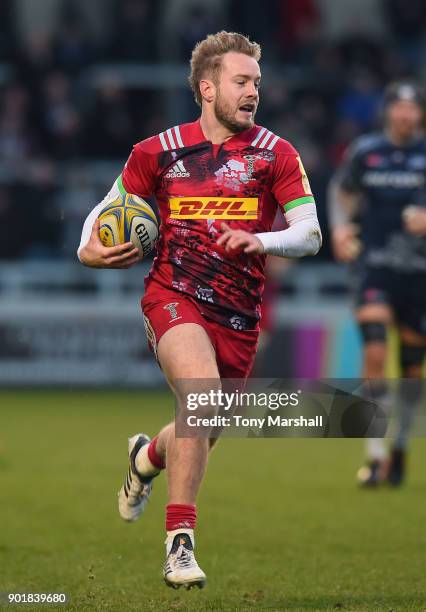 Charlie Walker of Harlequins runs in to score their second try during the Aviva Premiership match between Sale Sharks and Harlequins at AJ Bell...