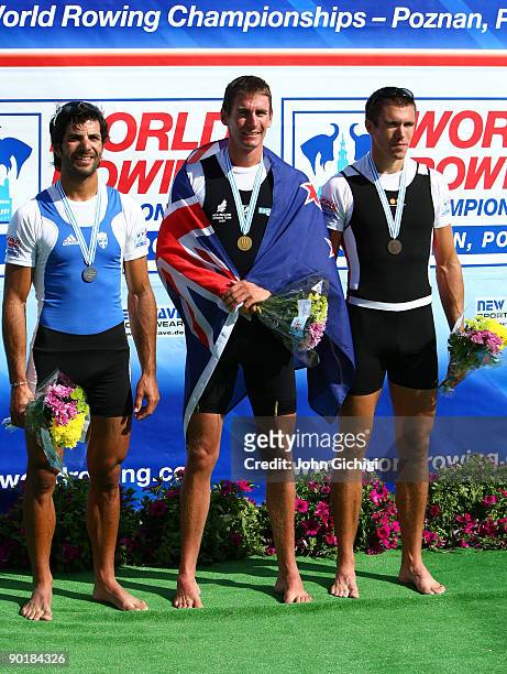 Vasileios Polymeros of Greece , Duncan Grant of New Zealand and Mads Rasmussen of Denmark pose after the final of the Men's Lightweight Single Sculls...