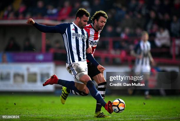 Hal Robson-Kanu of West Bromwich Albion shoots under pressure from Daniel Seaborne of Exeter City during the The Emirates FA Cup Third Round match...