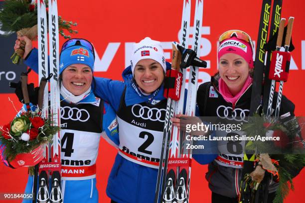 Heidi Weng of Norway takes 1st place, Krista Parmakoski of Finland takes 2nd place, Teresa Stadlober of Austria takes 3rd place during the FIS Nordic...