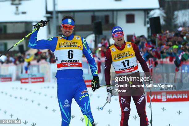 Alexey Poltoranin of Kazakhstan takes 1st place, Andrey Larkov of Russia takes 2nd place during the FIS Nordic World Cup Men's CC 15 km C Mass Start...