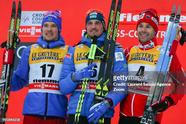 Alexey Poltoranin of Kazakhstan takes 1st place, Andrey Larkov of Russia takes 2nd place, Alex Harvey of Canada takes 3rd place during the FIS Nordic...