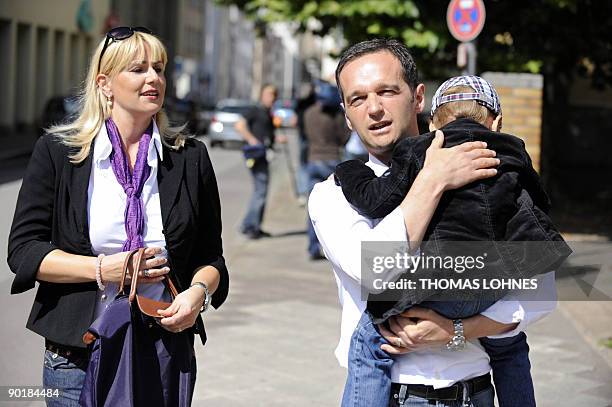 Saarland's Social Democtratic Party candidate Heiko Maas and his wife Corinna and son arrive to cast their votes in the south-western German city of...