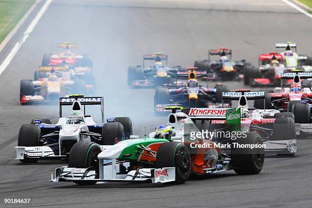 Giancarlo Fisichella of Italy and Force India leads the field at the start of the Belgian Grand Prix at the Circuit of Spa Francorchamps on August...