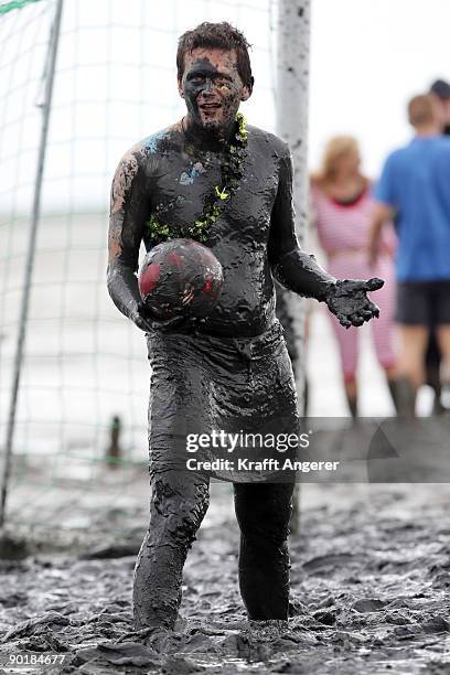 Participants play football during the Mudflat Olympic Games on August 30, 2009 in Brunsbuttel, Germany.