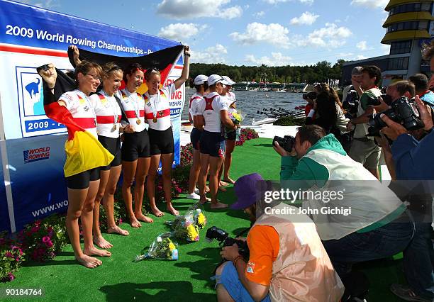 Julia Kroeger, Laura Tibitanzl, Helke Nieschlag and Lena Mueller of Germany pose for photographers after winning the Women's Lightweight Quadruple...